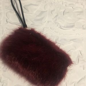 Fuzzy” burgundy wrist handbag